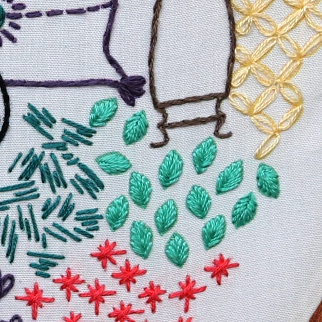 The cluster of leaves on the quilt in Catnap is rendered with the Leaf stitch.