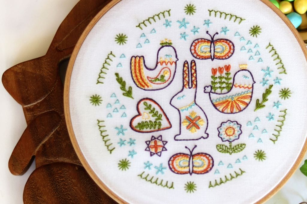 folk art-inspired embroidery pattern with chicks, bunnies, flowers and butterflies