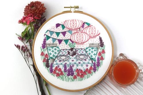summer themed embroidery kit with garden party scene