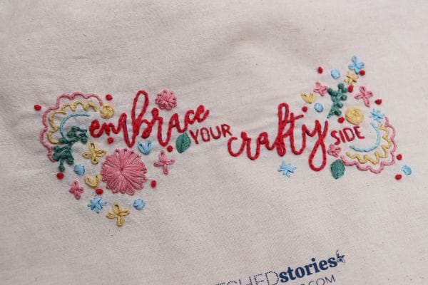 embroidered saying on Stitched Stories embroidery project tote bag