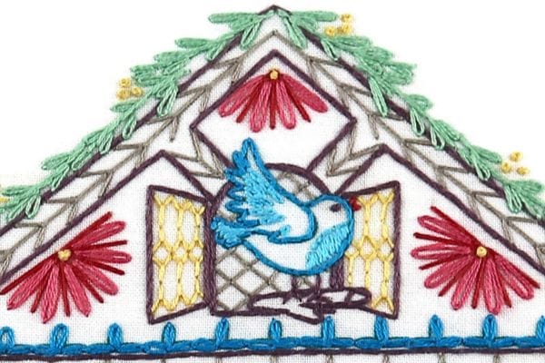 embroidered cuckoo clock and bird