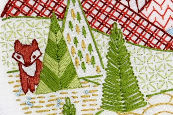 embroidered trees, mountains and wildlife