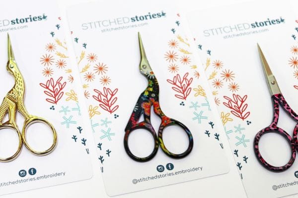 Embroidery scissors. 2 pair stork-shaped scissors. 1 pair regular with leopart print handles.