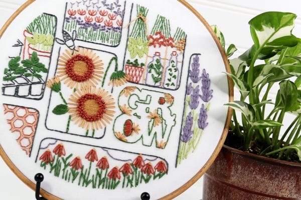 embroidery project with gardening motifs and flowers