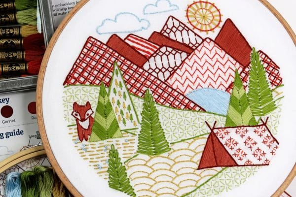Embroidered hoop-art of mountain and camping in Mountain Time