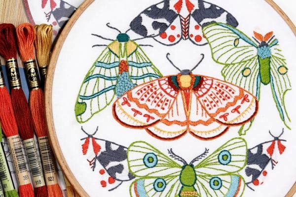 Embroidered hoop-art of moths