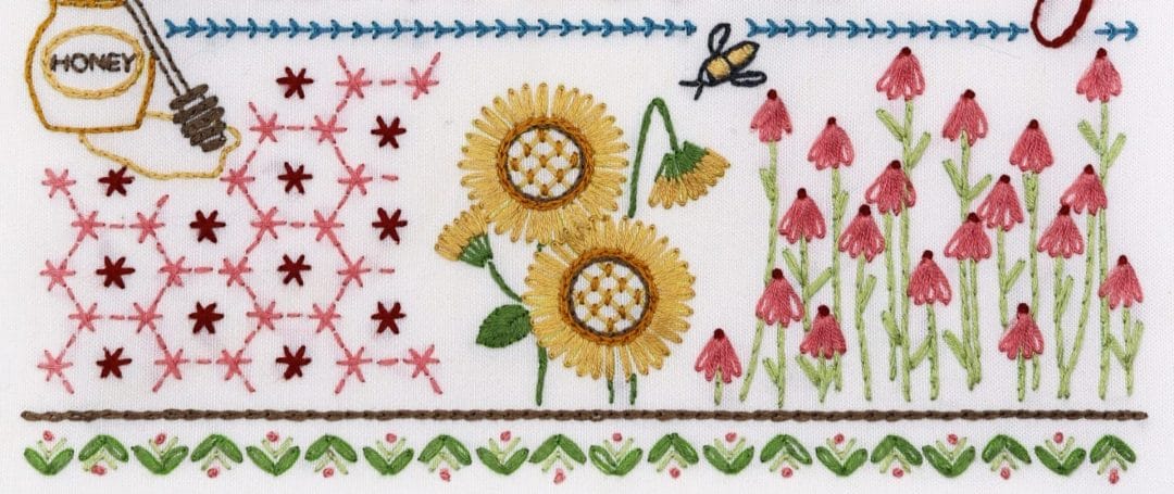 Embroidered detail from traditional embroidery stitch sampler with honeybee themes