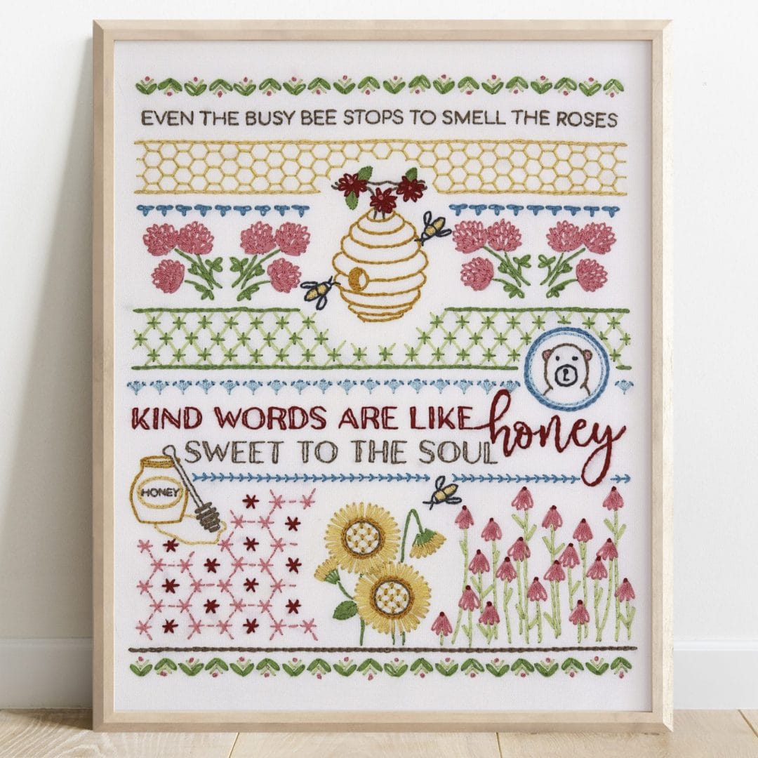 Traditional embroidery stitch sampler with honeybee themes