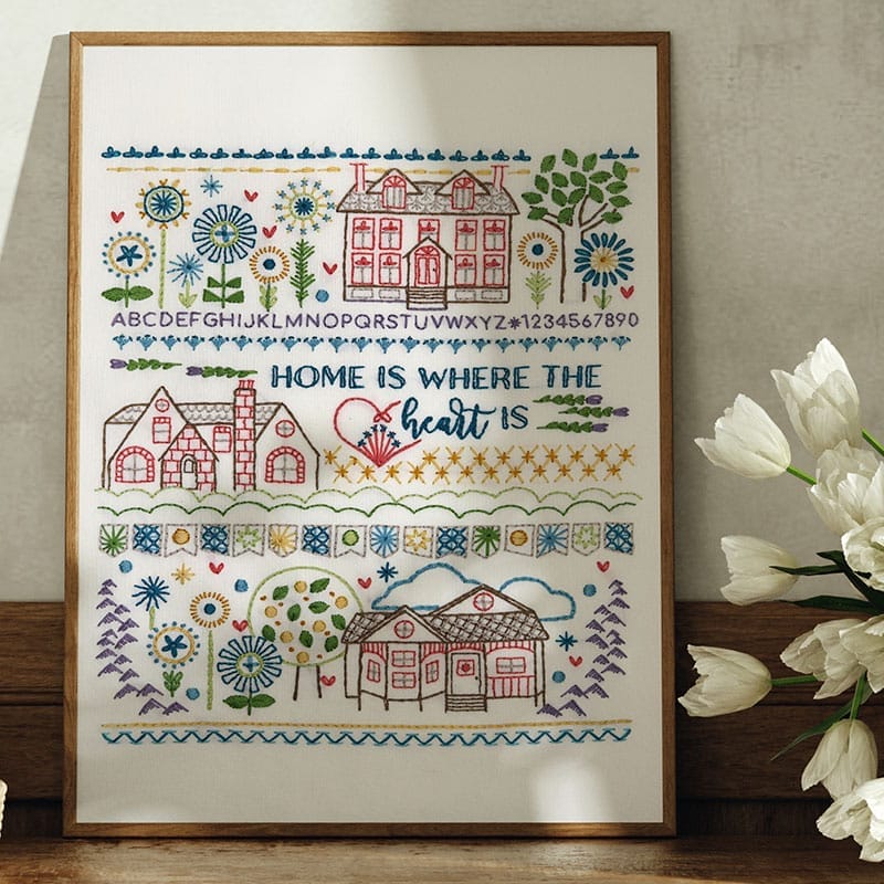framed embroidery stitch sampler with home theme