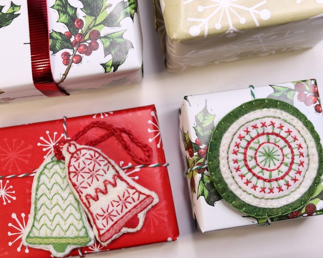 embroidered holiday ornaments used as gift tags