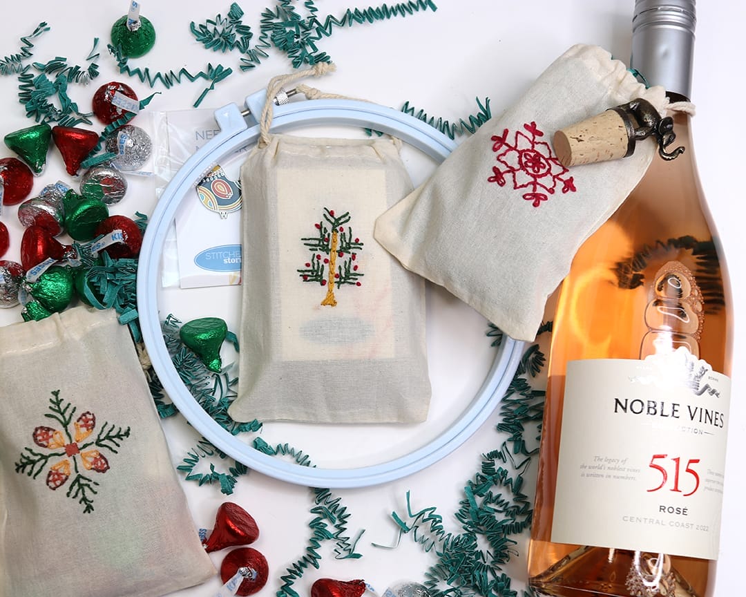 small canvas gift bags embroidered with holiday motifs