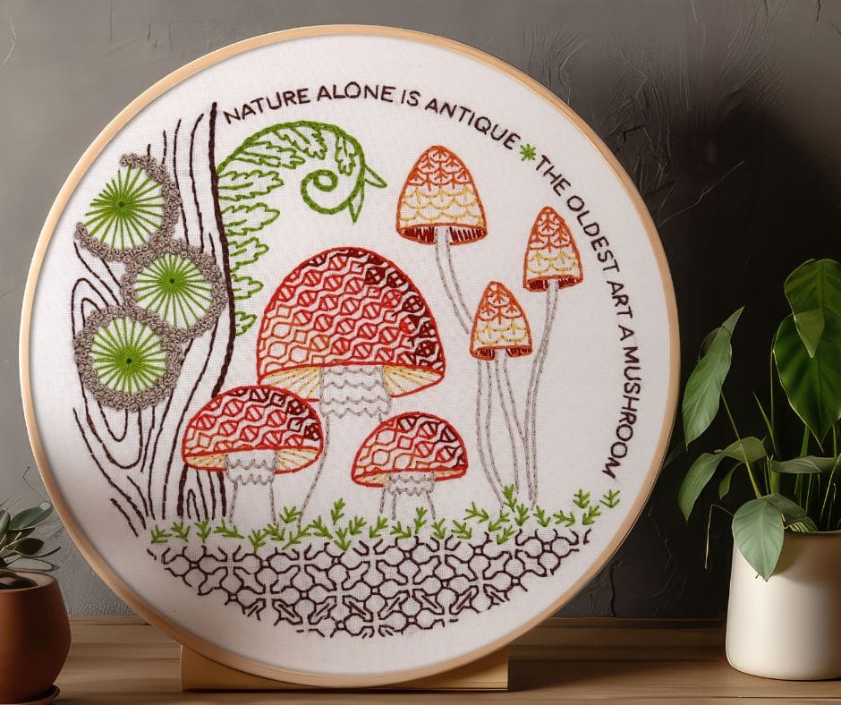 displayed embroidery hoop art with mushroom motif
