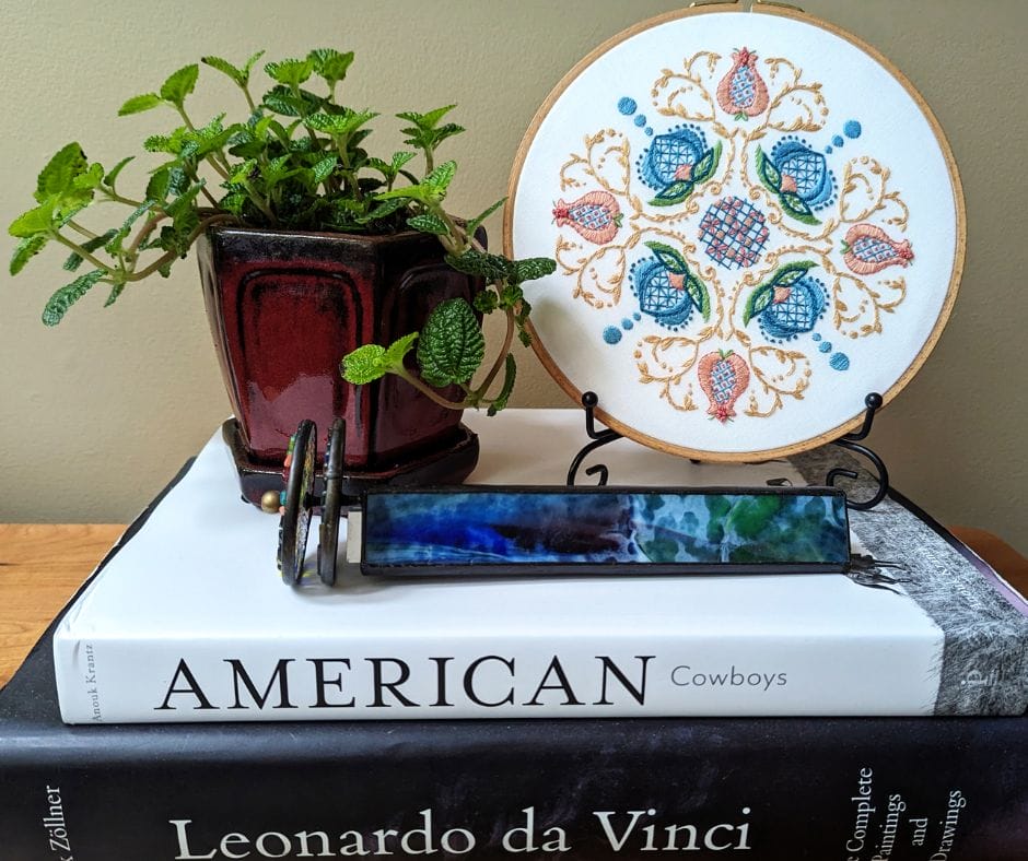 displayed embroidery hoop art with jacobean floral motif