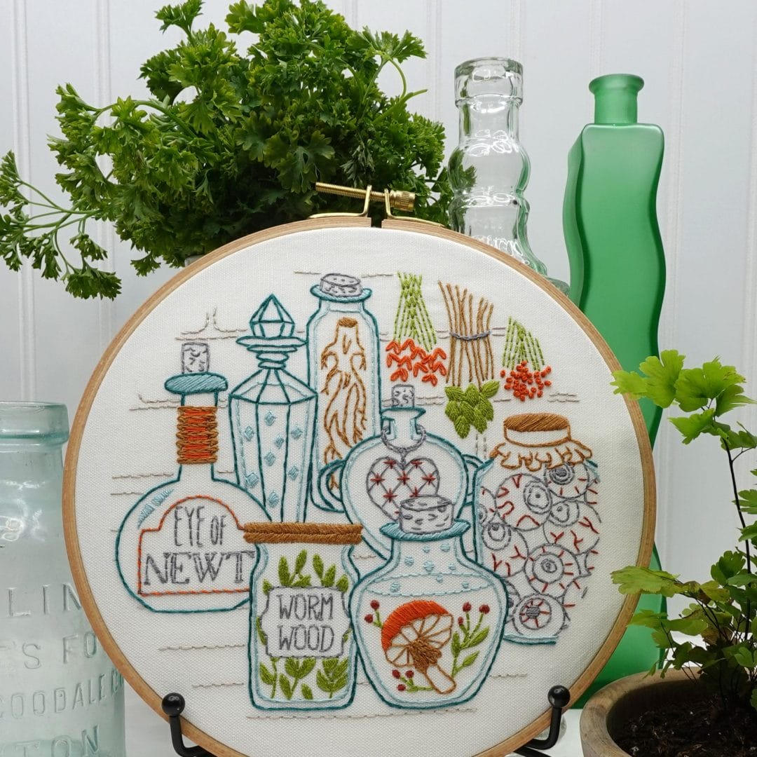 mushroom-themed embroidery hoop art on display