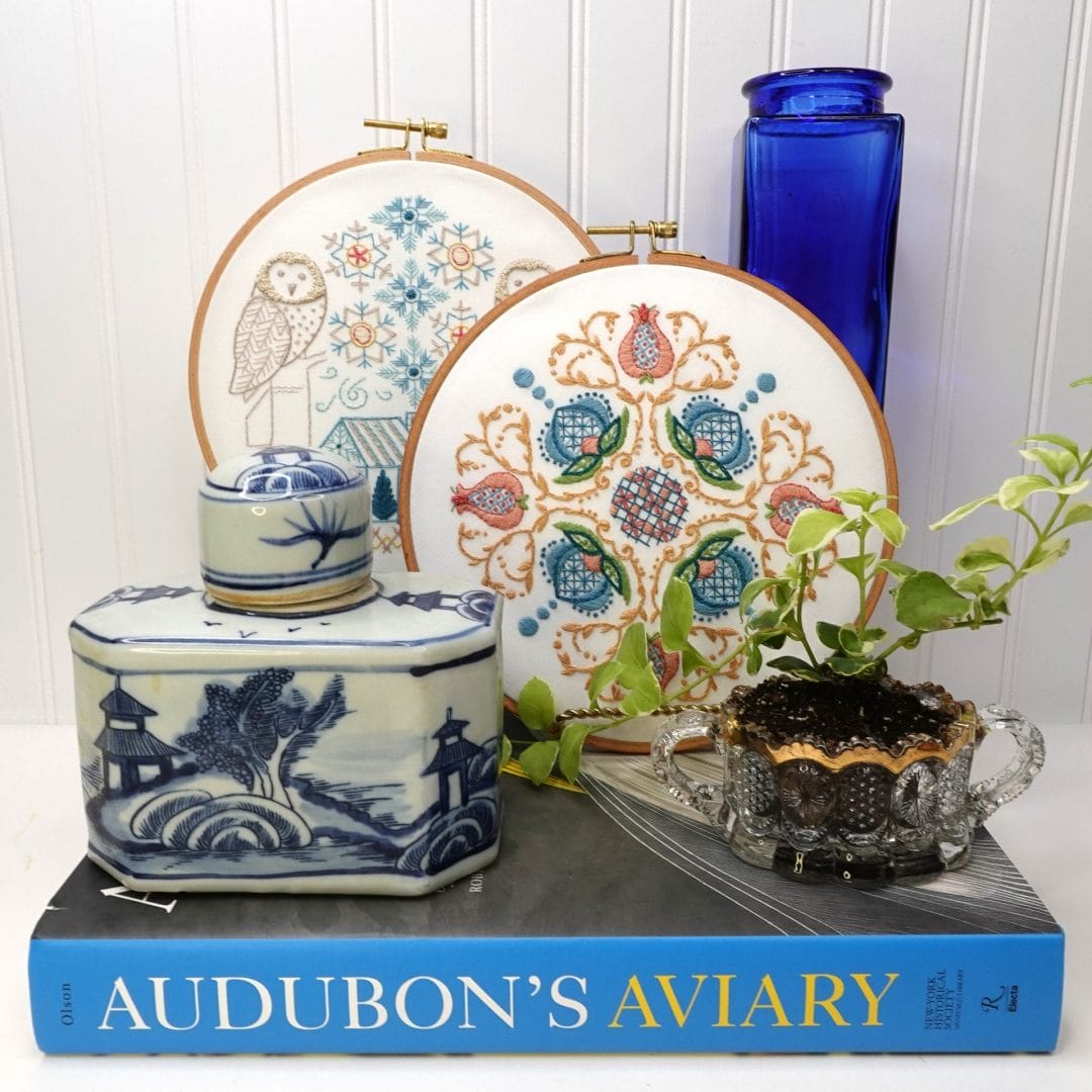 styled vignette with snowy owl and jacobean embroidery hoopart
