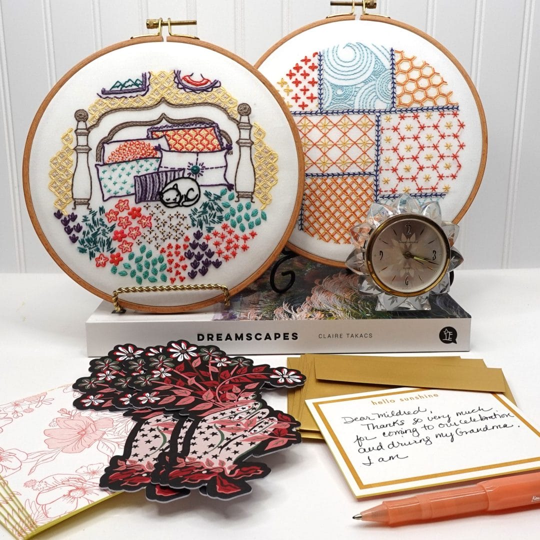 styled vignette with patchwork and cat nap embroidery hoopart