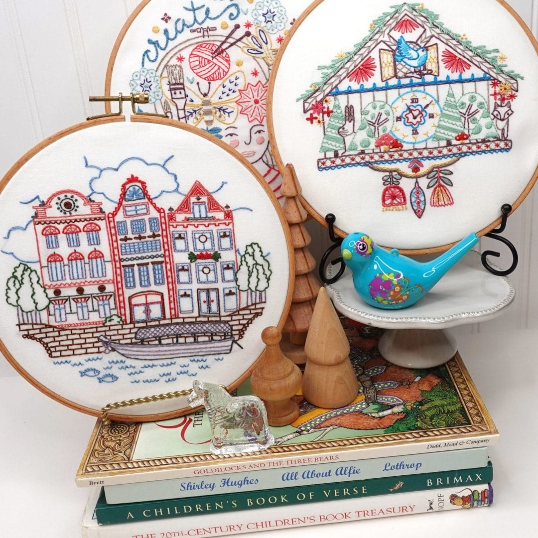 vignette of cozycore-inspired embroidery hoops